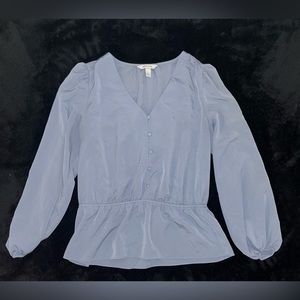 Blue blouse great for work or the office.